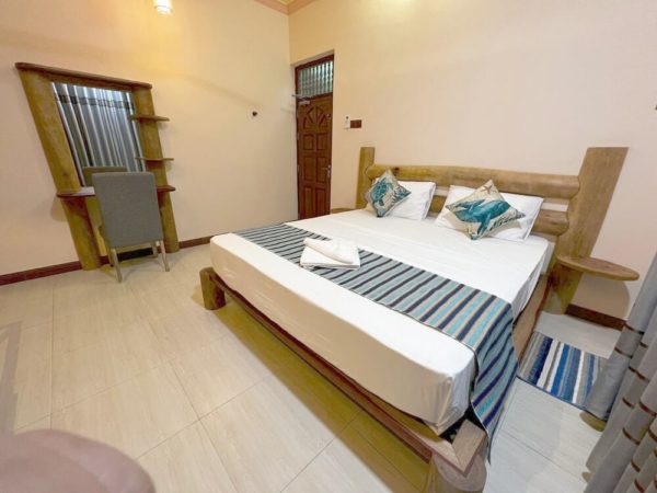 Divepoint Residence Zimmer mit Doppelbett